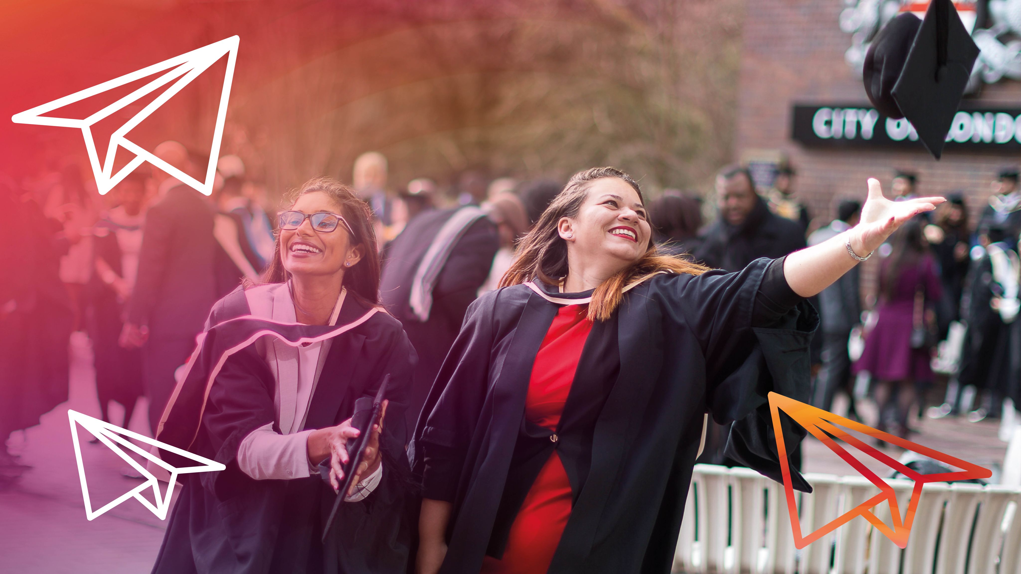 Female graduate throwing cap in the air