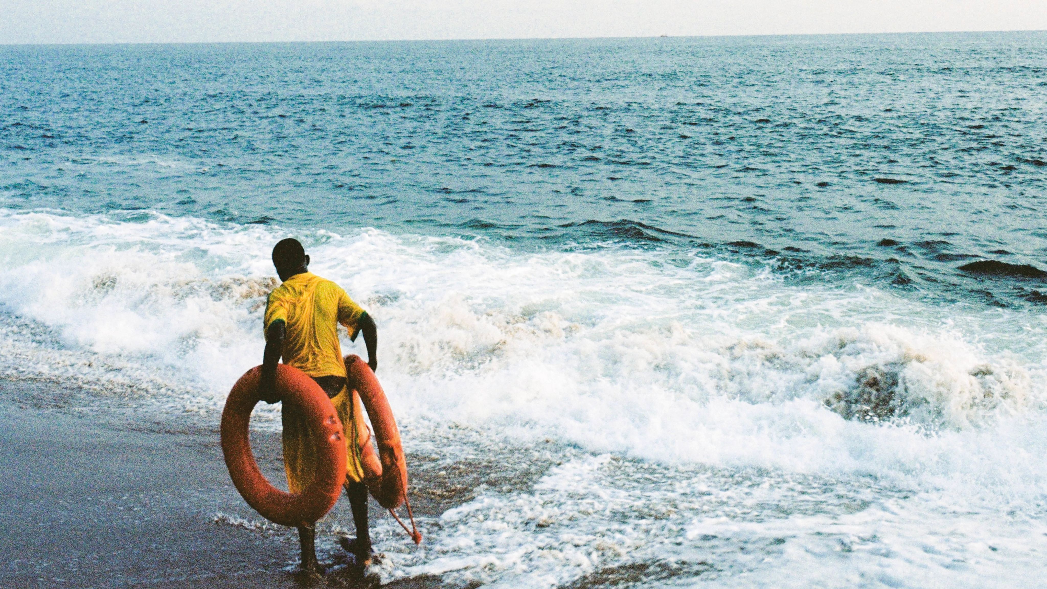 Refugee boy on shoreline